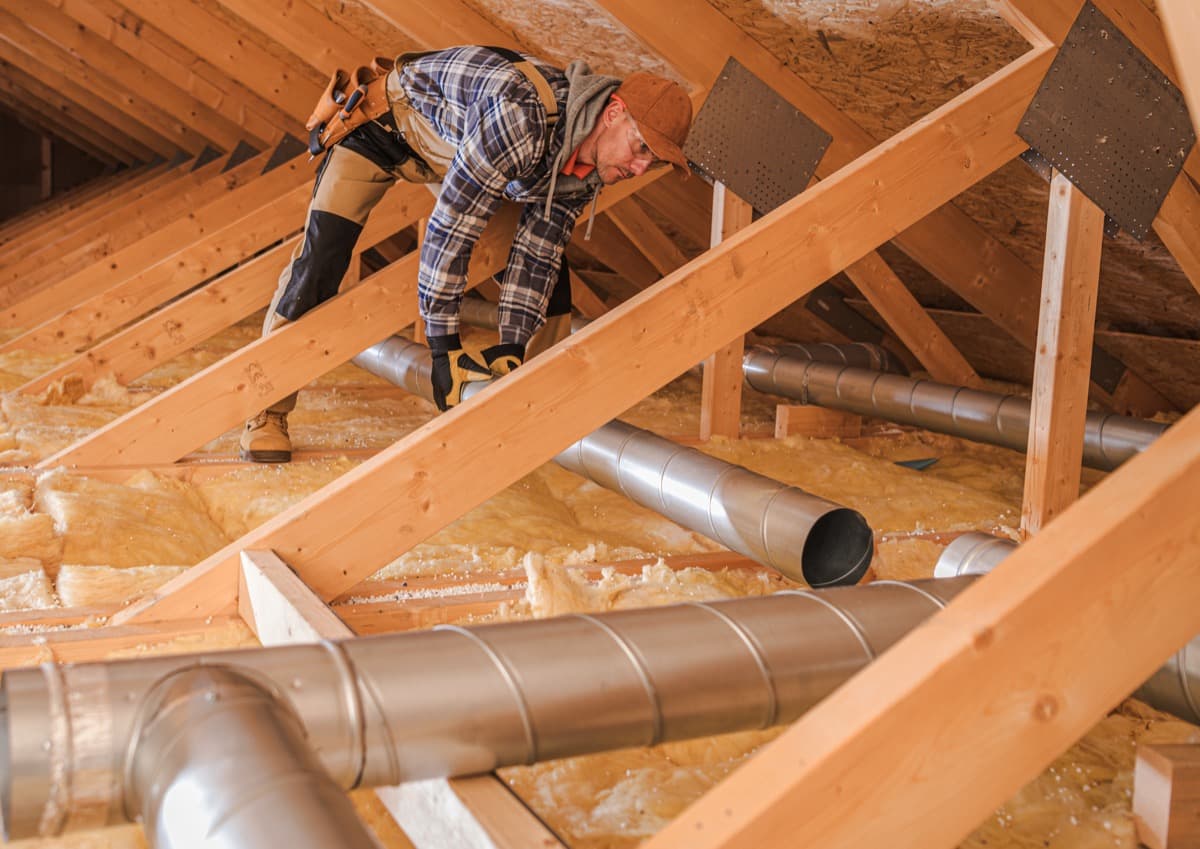 HVAC specialist installing residential ductwork
